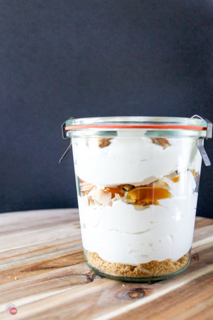These Cream Caramel Shooters are filled with fluffy cream cheese, whipped topping, caramel sauce, and toasted coconut! Make these ahead of time and wow you party guests!