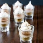 These no-bake cheesecake shooters have Nutella and salted caramel! Topped with whipped cream and chocolate shavings, these mini sweets can be made ahead of time! Nutella Salted Caramel Cheesecake Shooters Recipe | Take Two Tapas | #nutella #SaltedCaramel #PieRecipe #DessertShooters #TinyDesserts #SmallDessertRecipe