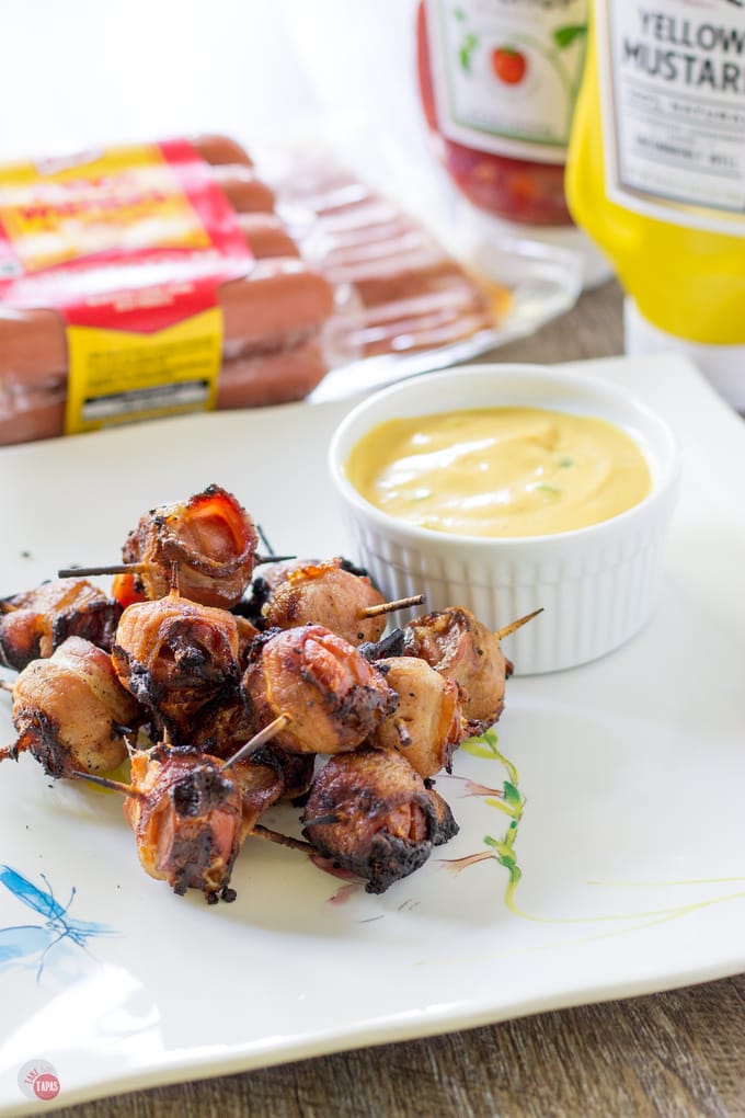 Bacon Hot Dog Bites with Summer Sauce | Take Two Tapas | #GrillAppetizers #HotDogRecipes #BaconWrappedHotDogs #Bacon #SummerGrilling #GrillRecipes #SummerRecipes