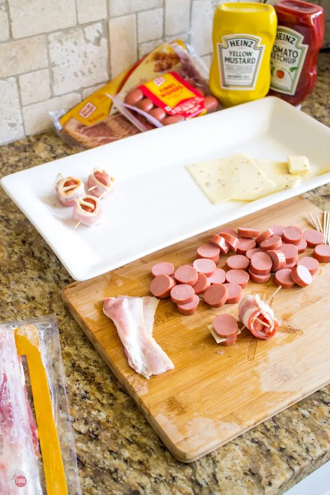 Bacon Hot Dog Bites with Dipping Sauce | Take Two Tapas | #GrillAppetizers #HotDogRecipes #BaconWrappedHotDogs #Bacon #SummerGrilling #GrillRecipes #SummerRecipes
