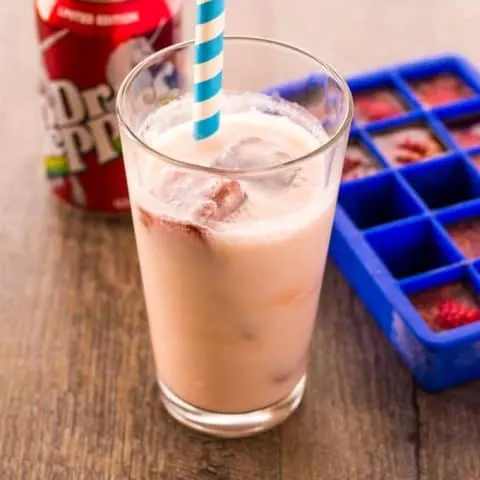 Dr. Pepper Inside out float, a can of Dr. Pepper and a Dr. Pepper ice cube tray on a wood surface