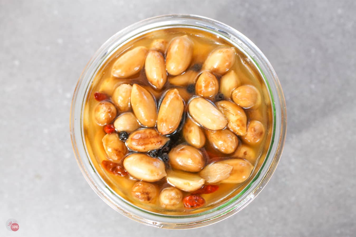 Overhead close up of Pickled Boiled Peanuts in a glass jar