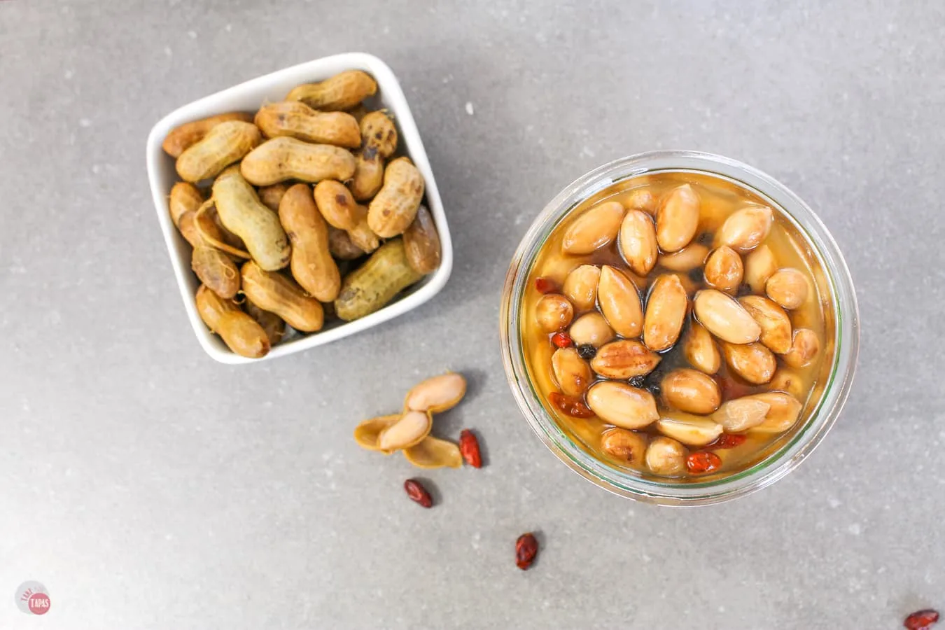 pickled nuts in a jar in the shell and out of the shell