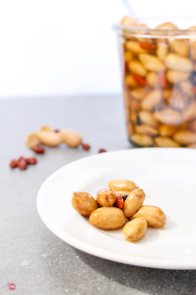 pickled boiled peanuts on a white plate