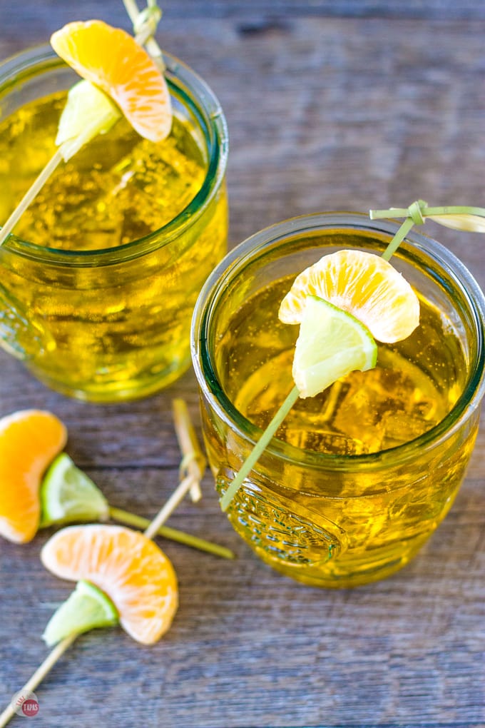 Overhead of Satsuma Orange Jubilee cocktails on a wood surface