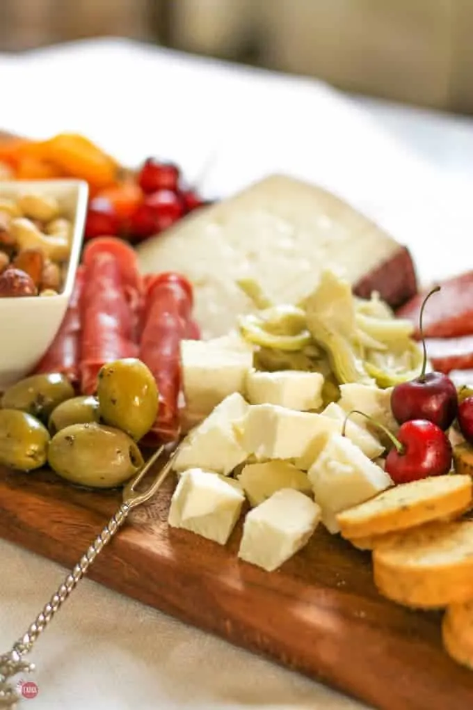 Grab some cheese on this summer tapas antipasto cheese board | Take Two Tapas | #SummerEntertaining #EasyEntertaining #CheeseBoardIdeas #CheeseBoardDisplay #Antipasto #Tapas #CheeseBoard