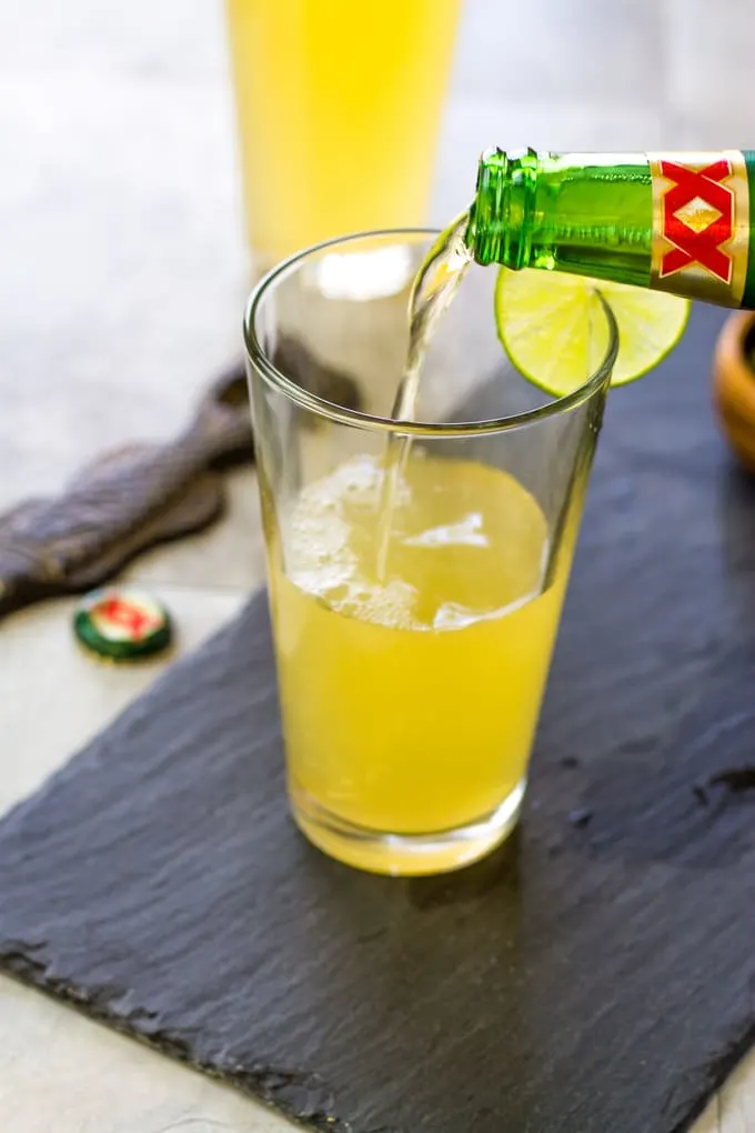 Add the beer to your limeade and tequila mixture. Margarita Beer Shandy Cocktail | Take Two Tapas | #margarita #beer #Shandy #cocktails