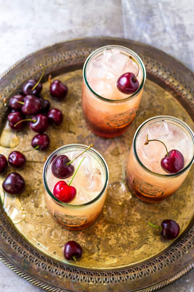 overhead picture of cocktails on a silver platter