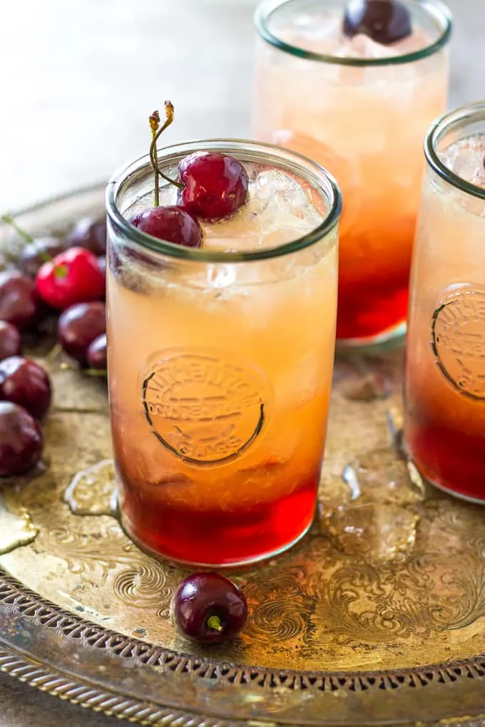side angle of cherry amaretto cocktails