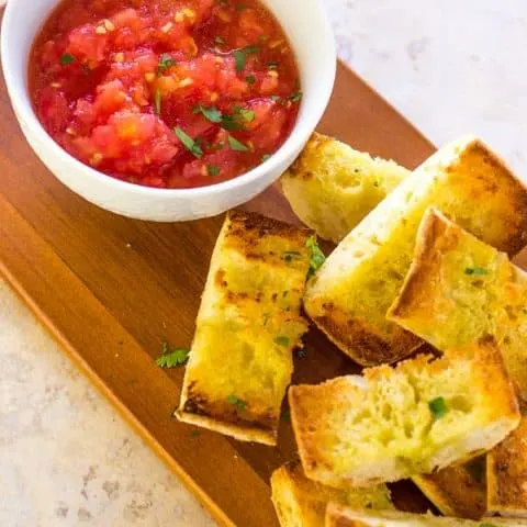 Overhead of Pan con Tomate on a cutting board