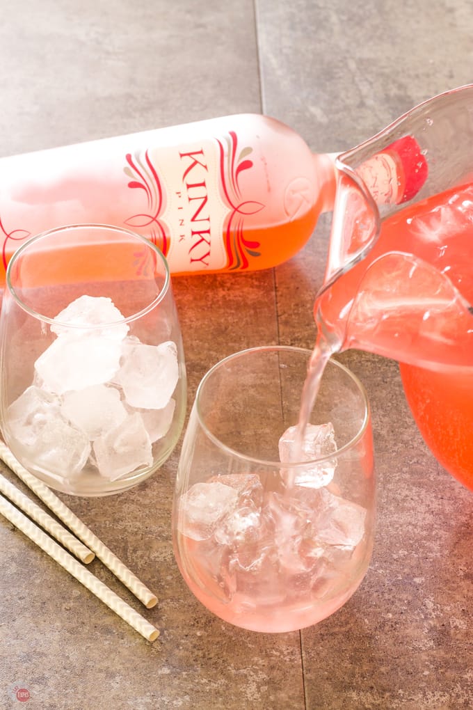 Pouring the Pink Passion Party Punch in to glasses