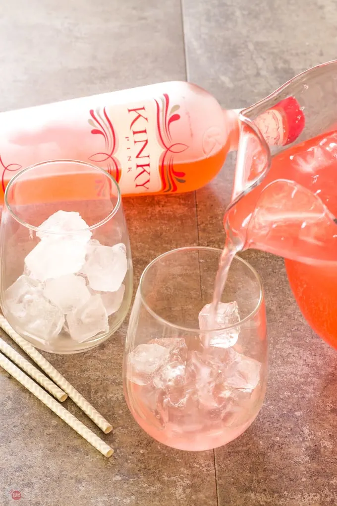 Pouring the Pink Passion Party Punch in to glasses
