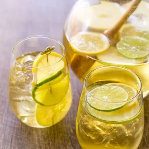 Summer Apple Sangria in 2 glasses and a glass pitcher