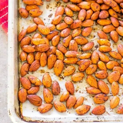 Smoked Paprika Almonds spread out on a sheet pan