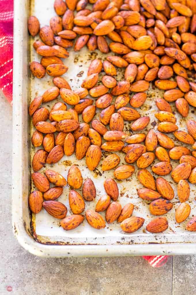 Smoked Paprika Almonds spread out on a sheet pan