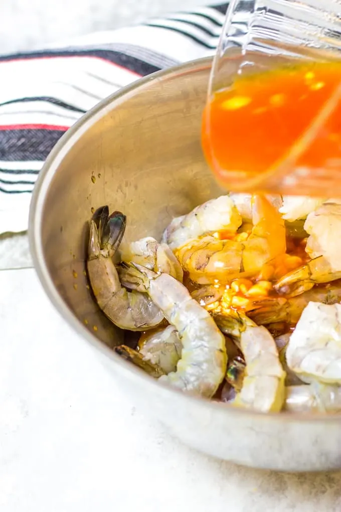 Pour over the marinade. Spicy Margarita Shrimp Skewers | Take Two Tapas | #Margarita #ShrimpSkewers #SkewerRecipes #SeafoodSkewers #MargaritaShrimp #TequilaShrimp
