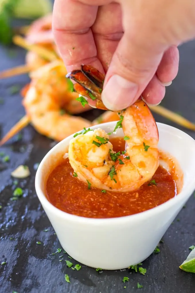 Dipping the Spicy Margarita Shrimp Skewers in the Spicy Cocktail Sauce
