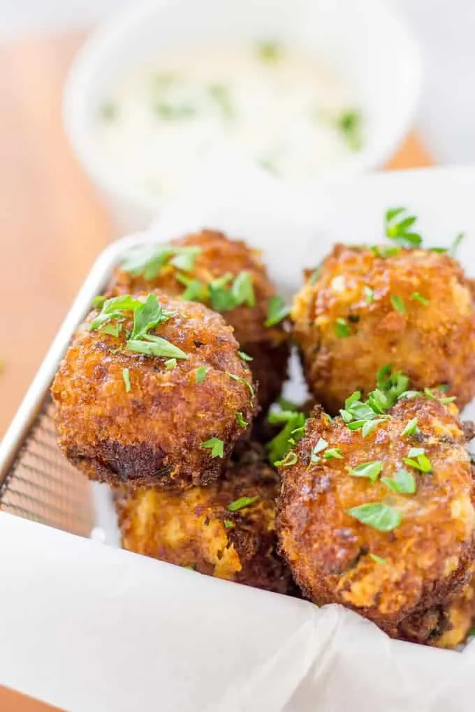 Fried Bacon Manchego Croquettes in a paper lined fry basket