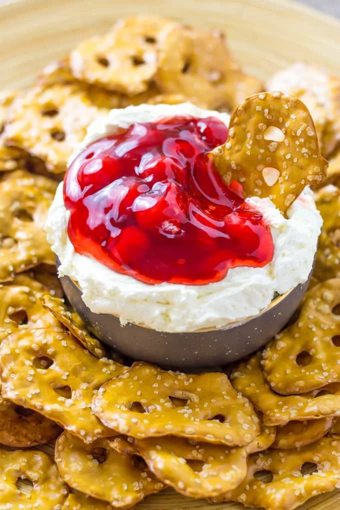close up of cheesecake dip with cherry pie filling