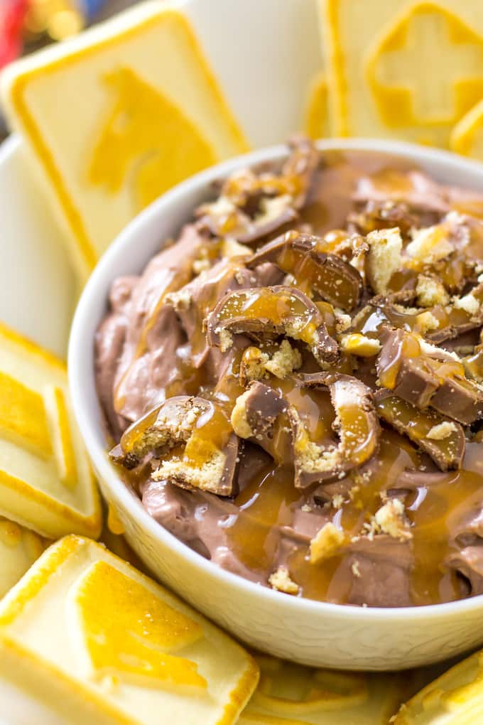 close up of Twix dip surrounded by cookies