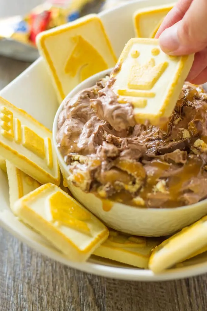 dip shortbread cookies in chocolate caramel twix dip