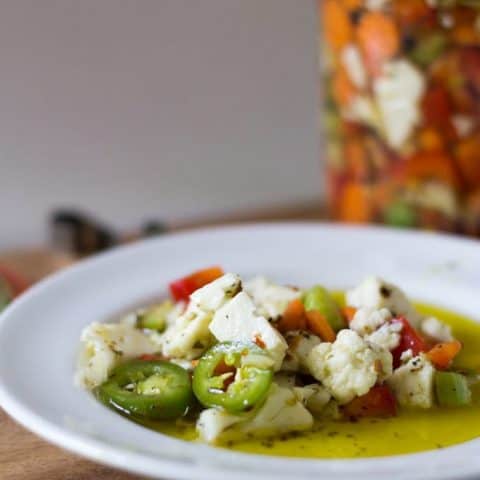 Close up of Giardiniera pickled vegetable relish on a white plate