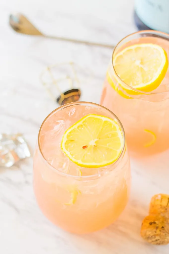 Overhead of lemon wedge on top of Grapefruit Lemonade Crush cocktail