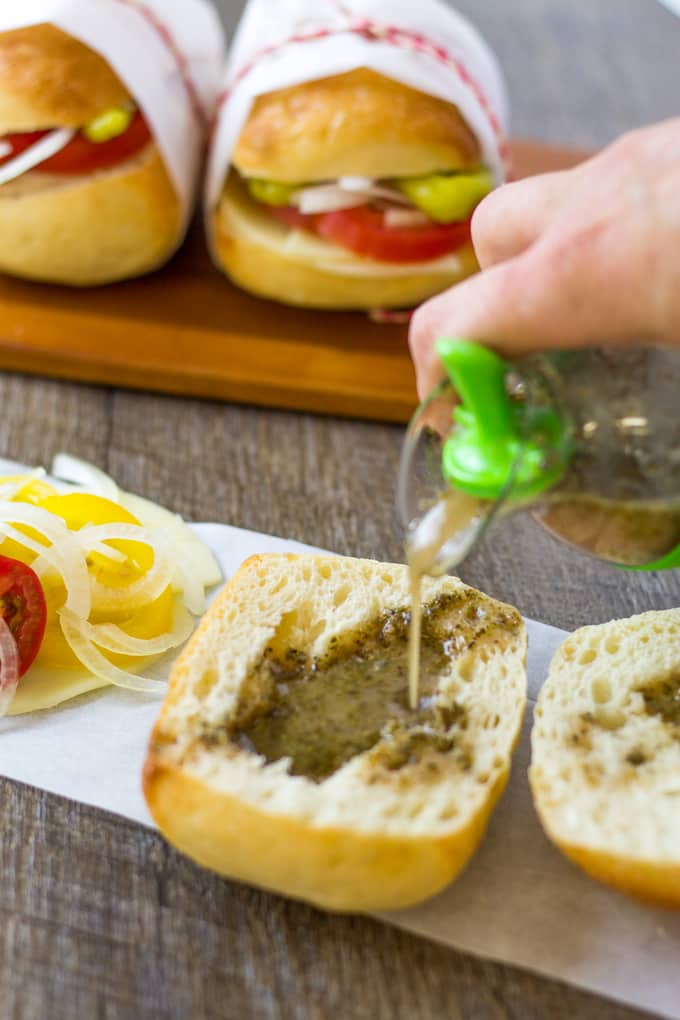 This homemade red wine vinaigrette on these Mini Veggie Italian Slider Subs is what makes this sandwich! | Take Two Tapas | #VegetarianSliders #PicnicSandwiches #PicnicIdeas #VeggieSandwiches #VegetarianSubs