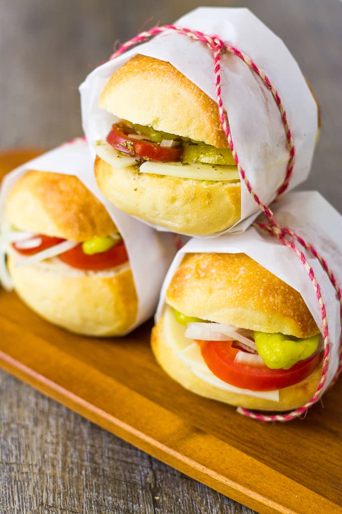 These Mini Veggie Italian Slider Subs will be a hit for any tailgating situation! | Take Two Tapas | #VegetarianSliders #PicnicSandwiches #PicnicIdeas #VeggieSandwiches #VegetarianSubs