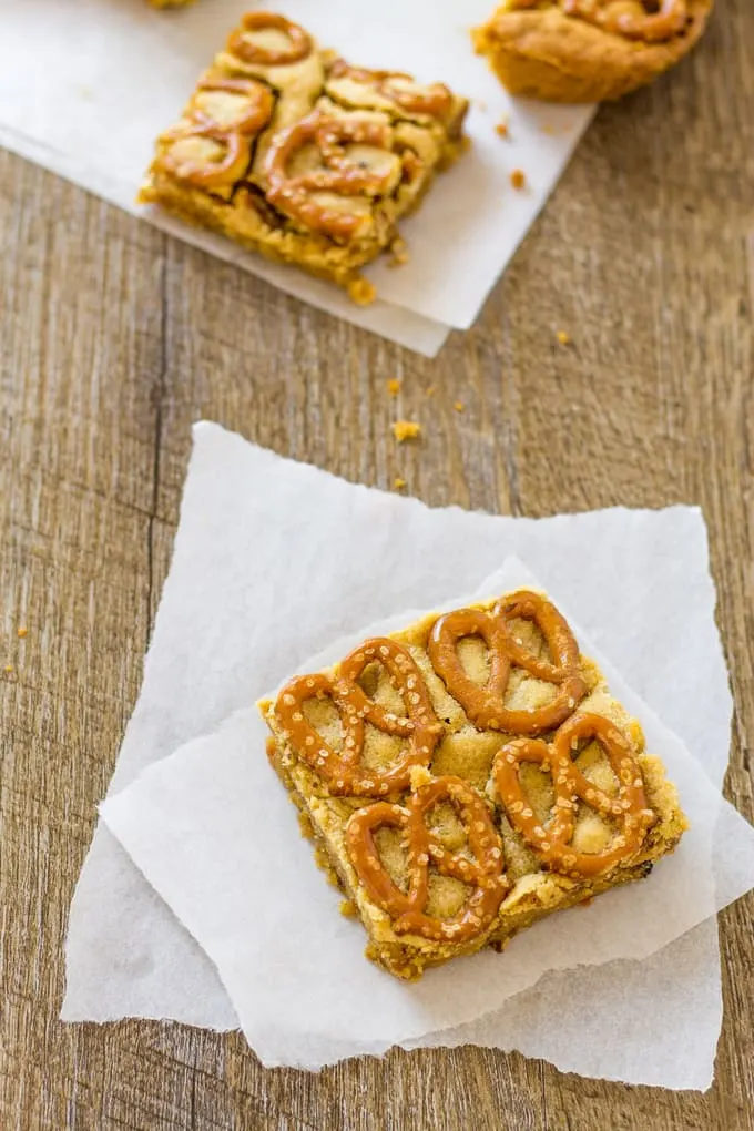 These peanut butter pretzel bars are overflowing with goodness as well as bacon and bourbon! | Take Two Tapas | #PeanutButter #Pretzels #PeanutButterBars #BrownieRecipe #Bacon #PeanutButterRecipes