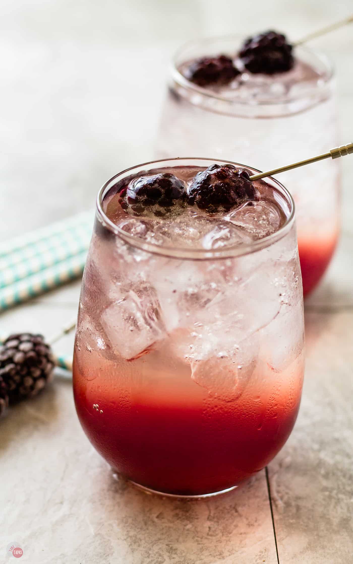 The layered cocktail always looks gorgeous to me and my Blackberry Coconut Splash cocktail is no exception | Take Two Tapas