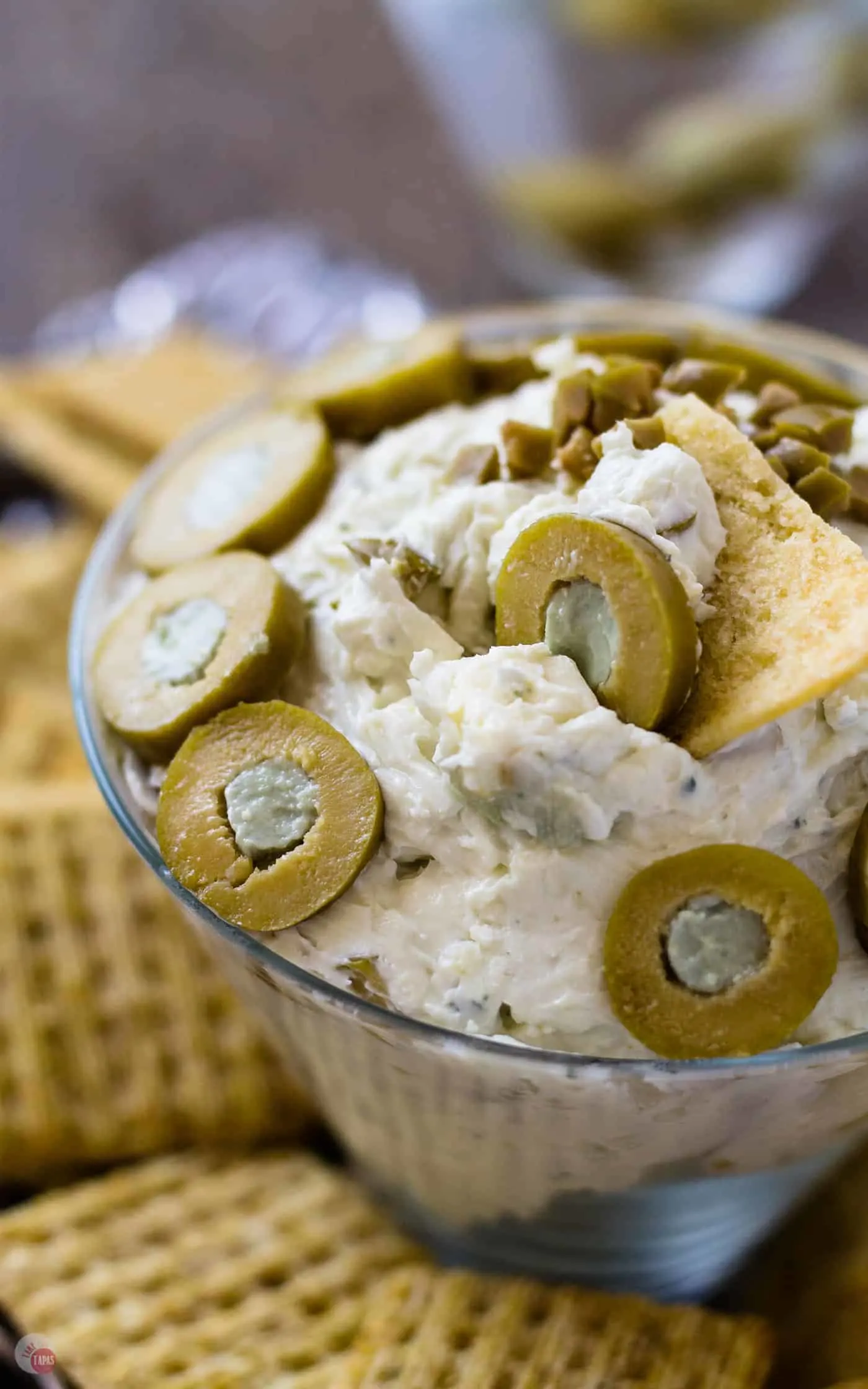A classic Dirty Martini is turned into an amazing party dish with a little kick. Check out my Dirty Martini Cheese Ball with Blue Cheese Stuffed Olives! | Take Two Tapas