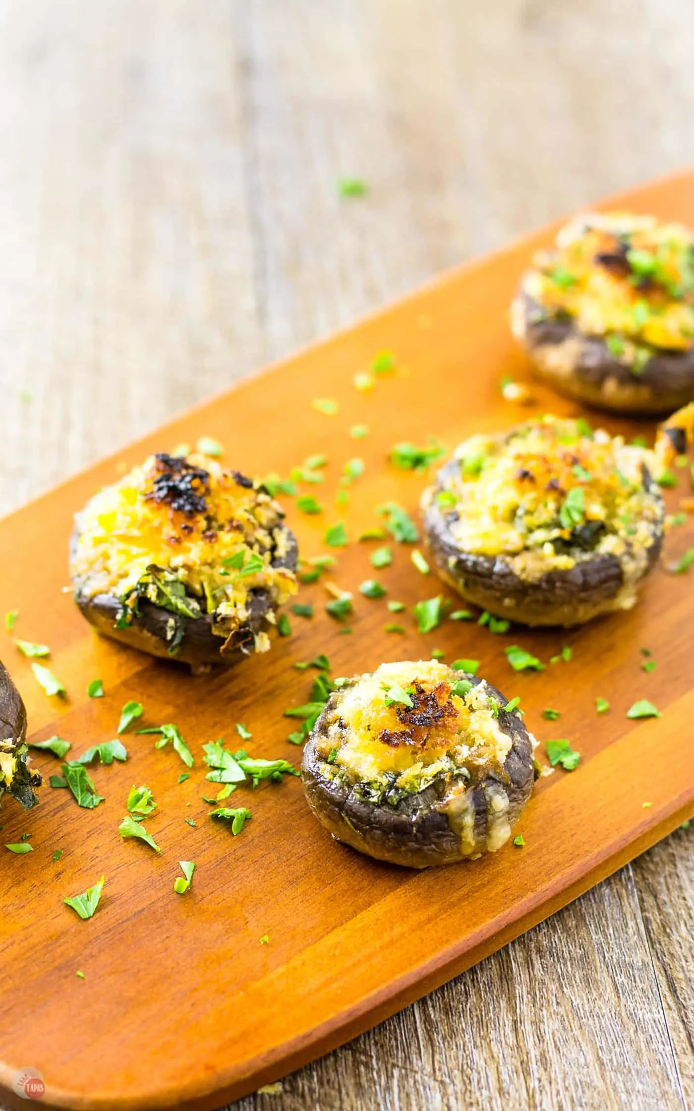 wood platter with stuffed mushrooms