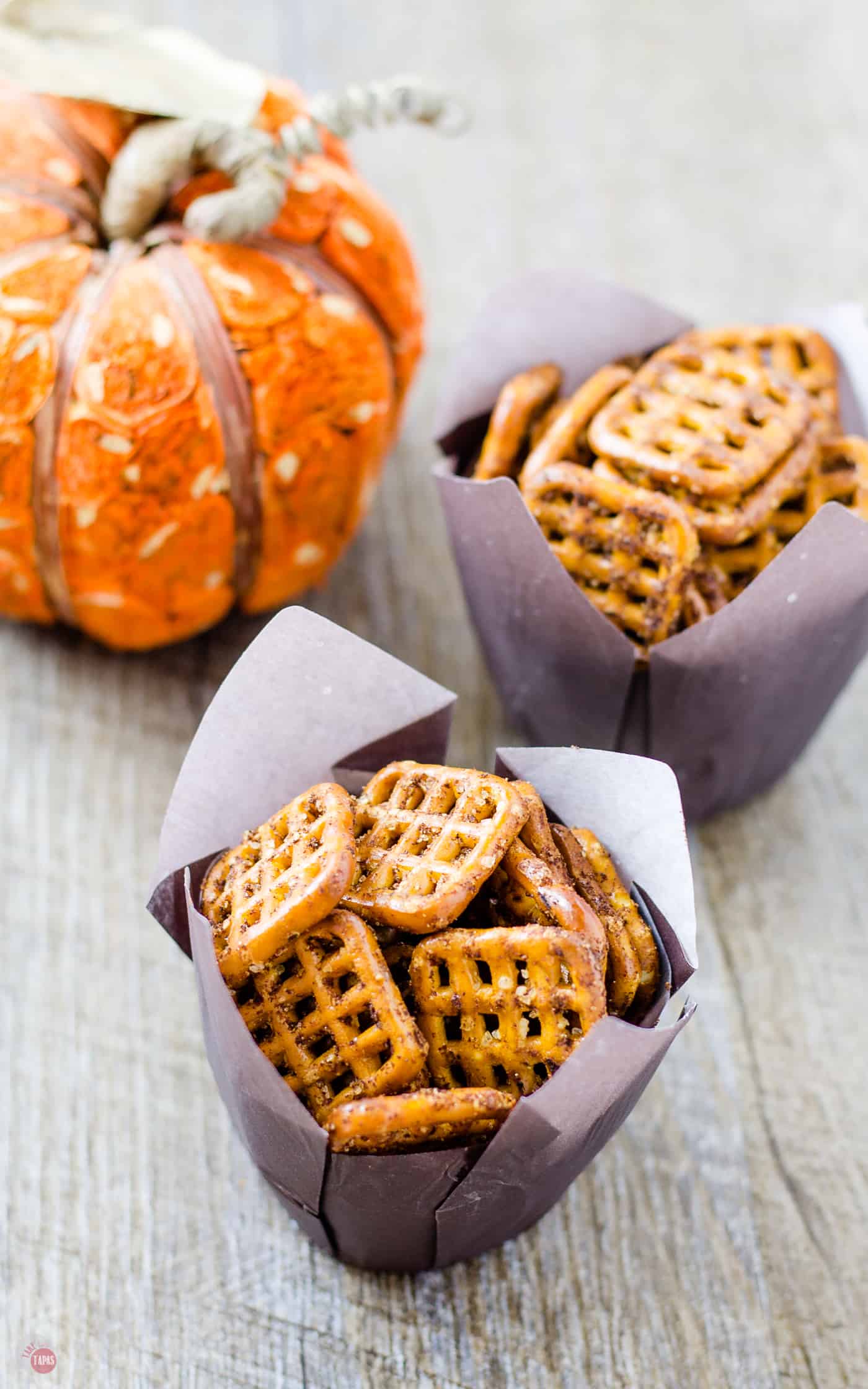 Serve these Pumpkin Spice Espresso Pretzels in fun cupcake wrappers! | Take Two Tapas | #PumpkinPieSpice #PumpkinSpiceRecipes #Pretzels #Snacks #FallRecipes #ThanksgivingAppetizers