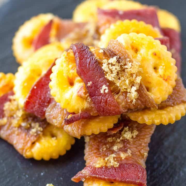Sweet and Spicy Bacon Crackers on a black plate