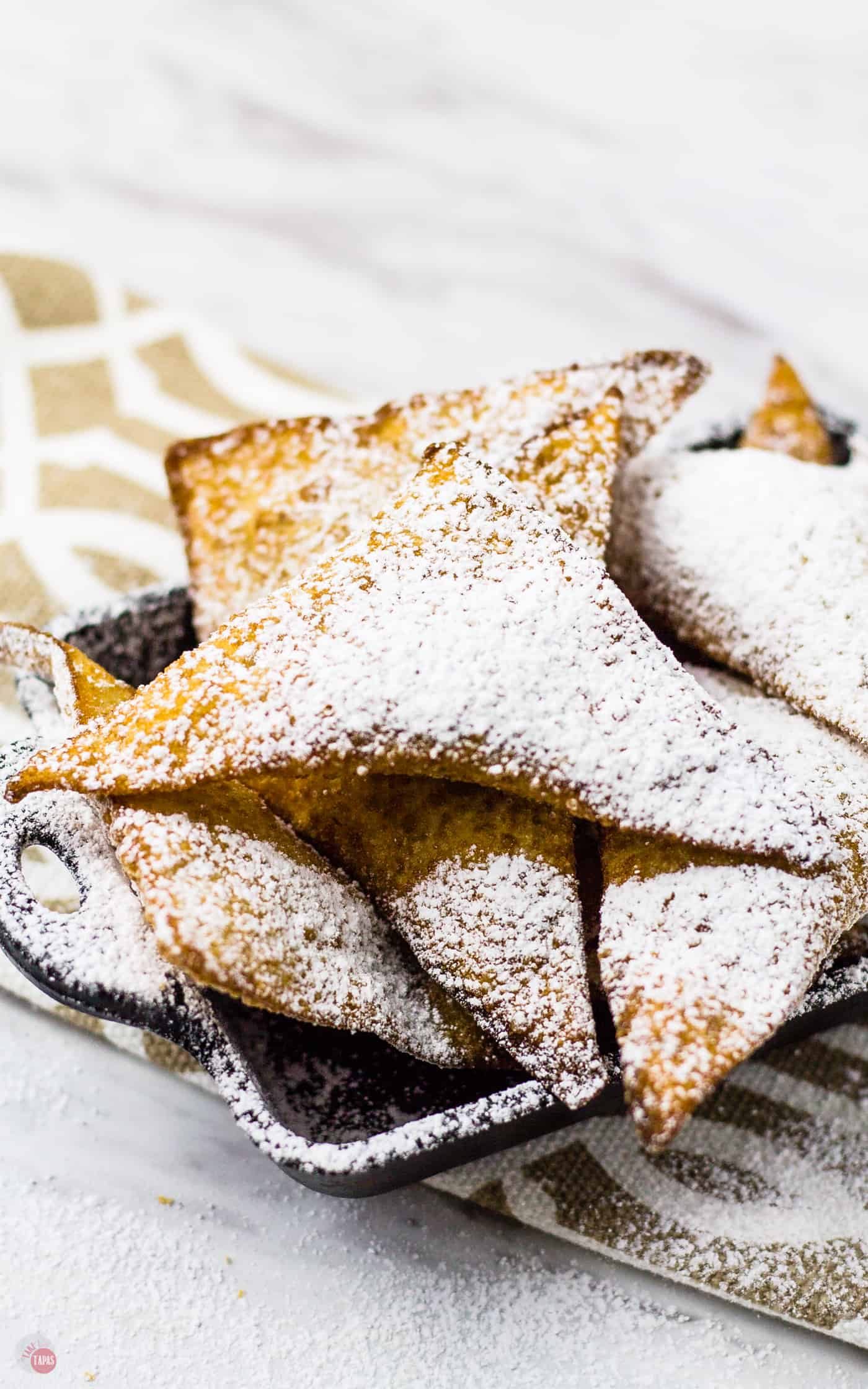 These German Chocolate Wontons look like crispy little pillows dusted in powdered sugar | Take Two Tapas
