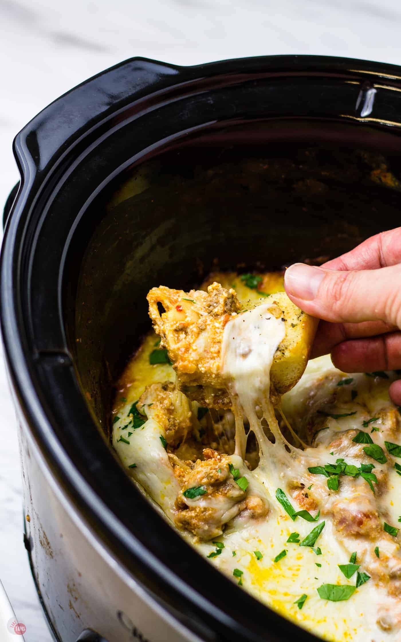 Dip your breadstick into my extra cheesy lasagna dip made in a crockpot! 