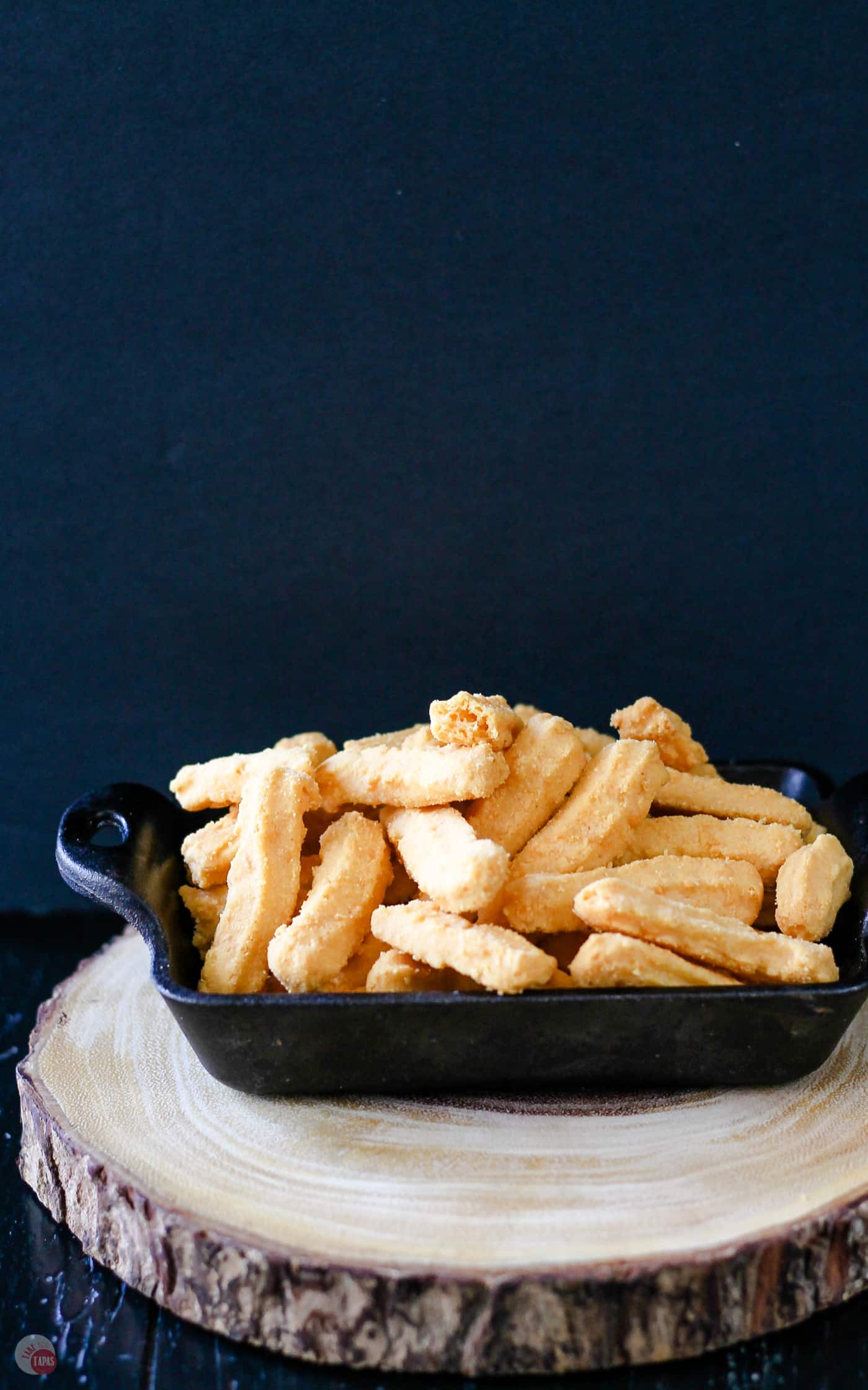 Cast iron pan with pimento cheese straws in it