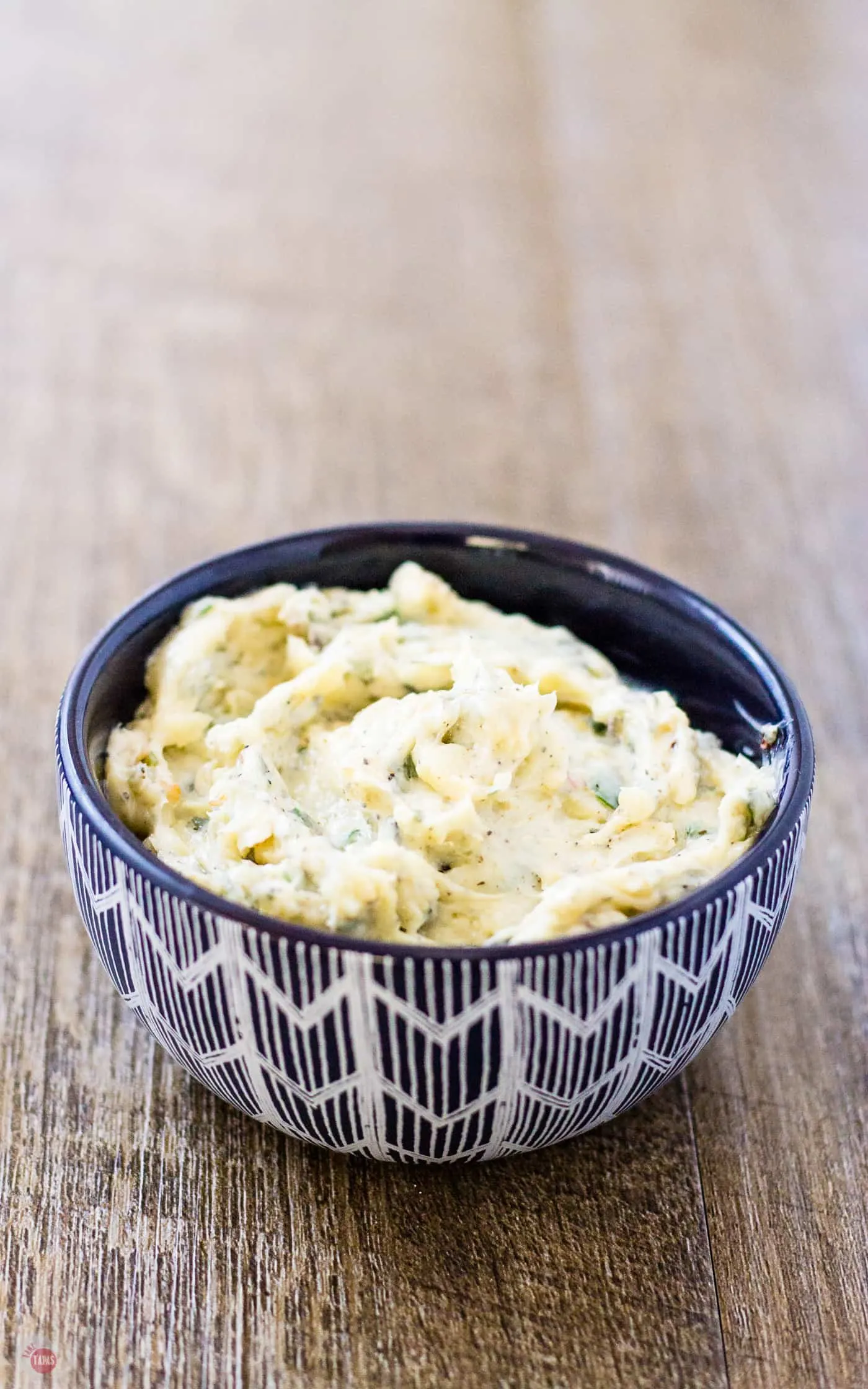Have fresh herbs left over? Mix them with butter and roasted garlic to make a compound butter. My roasted garlic spread will blow your mind! | Take Two Tapas | #RoastedGarlic #CompoundButter #FreshHerbs #ButterRecipe #GarlicSpread