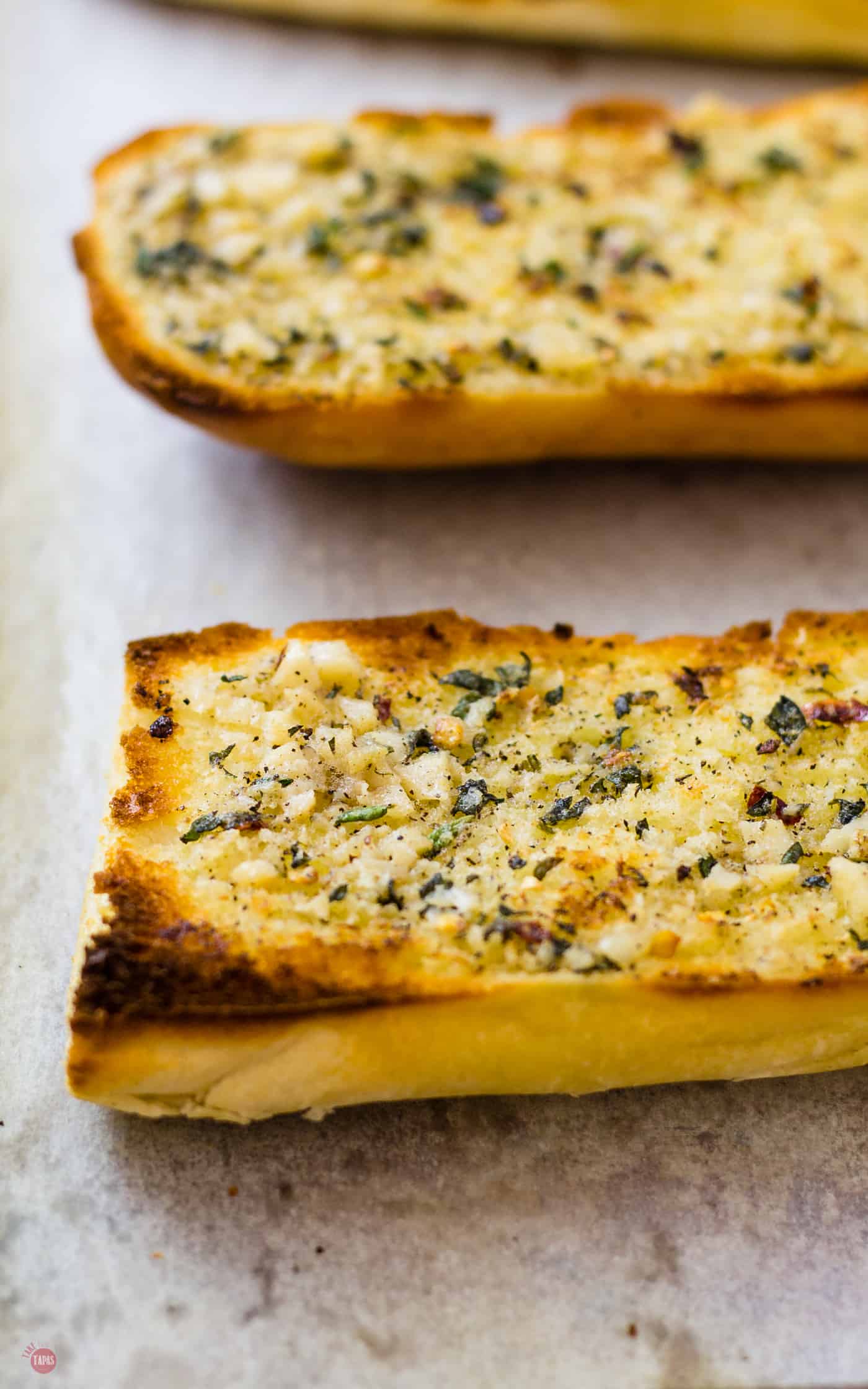 Spread the roasted garlic spread on some leftover bread and make some quick garlic bread for dinner! | Take Two Tapas | #RoastedGarlic #CompoundButter #FreshHerbs #ButterRecipe #GarlicSpread