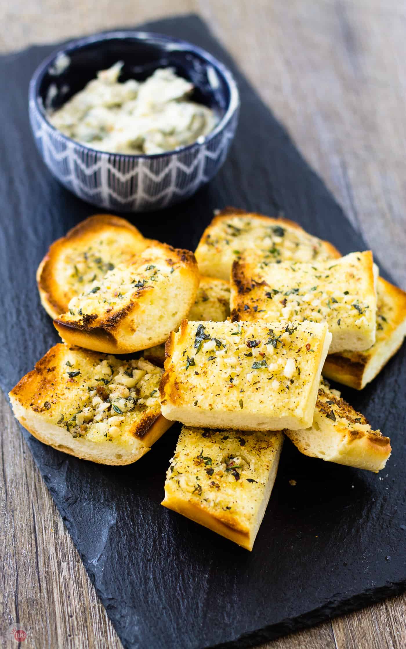 Make gourmet garlic bread with my roasted garlic spread | Take Two Tapas | #RoastedGarlic #CompoundButter #FreshHerbs #ButterRecipe #GarlicSpread