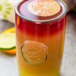 Forget the tequila and bring your red wine to the table for my Sangria Sunrise | Take Two Tapas | #Sangria #TequilaSunrise #LayeredCocktail #OrangeJuice #TequilaCocktails #BrunchCocktails