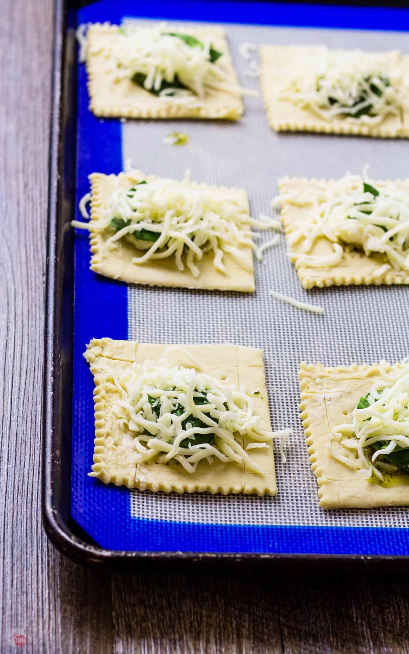 Spinach or no, these White Pizza Mini Tarts will be a hit! | Take Two Tapas #pizza #WhitePizza #Tarts
