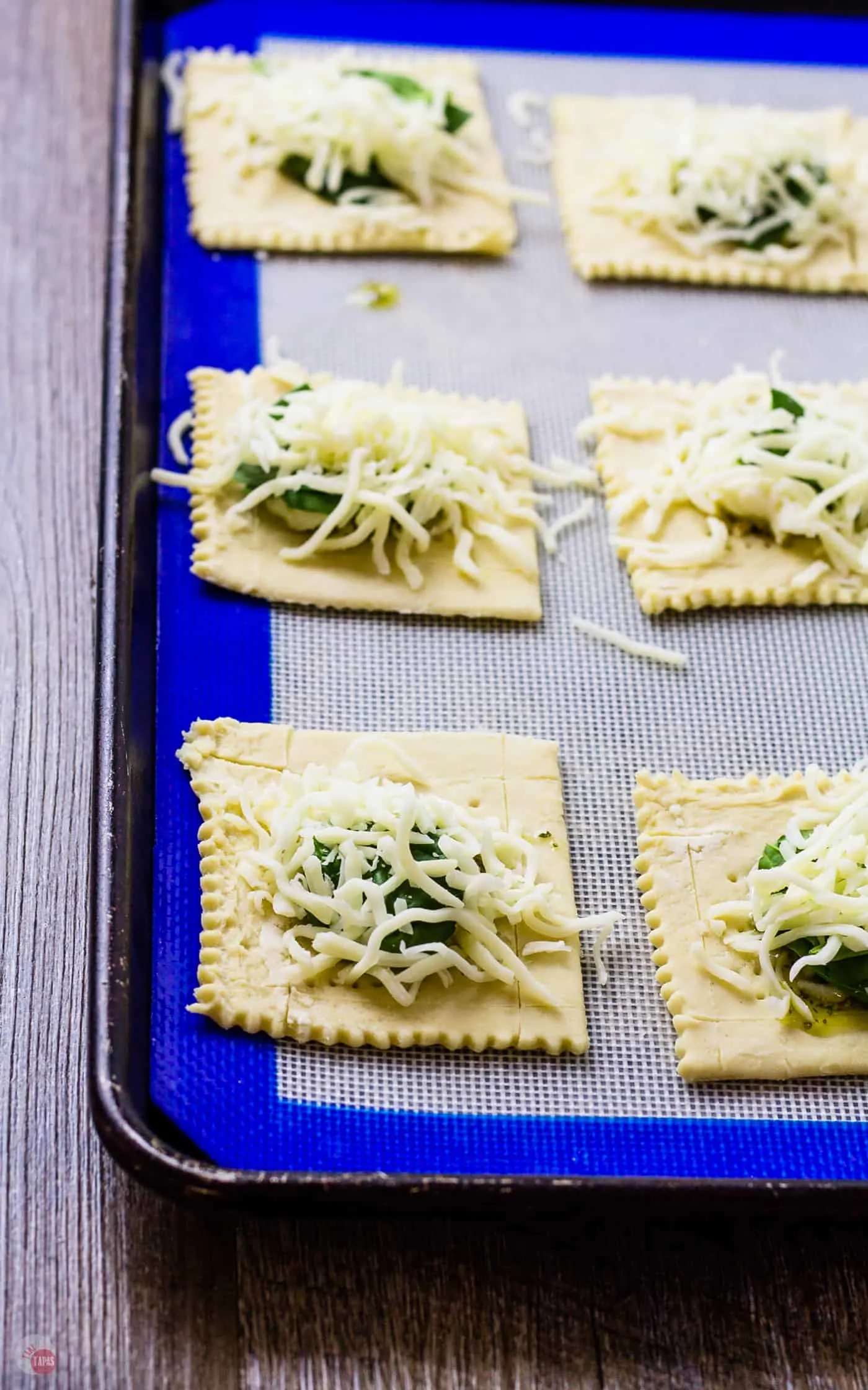 Spinach or no, these White Pizza Mini Tarts will be a hit! | Take Two Tapas #pizza #WhitePizza #Tarts