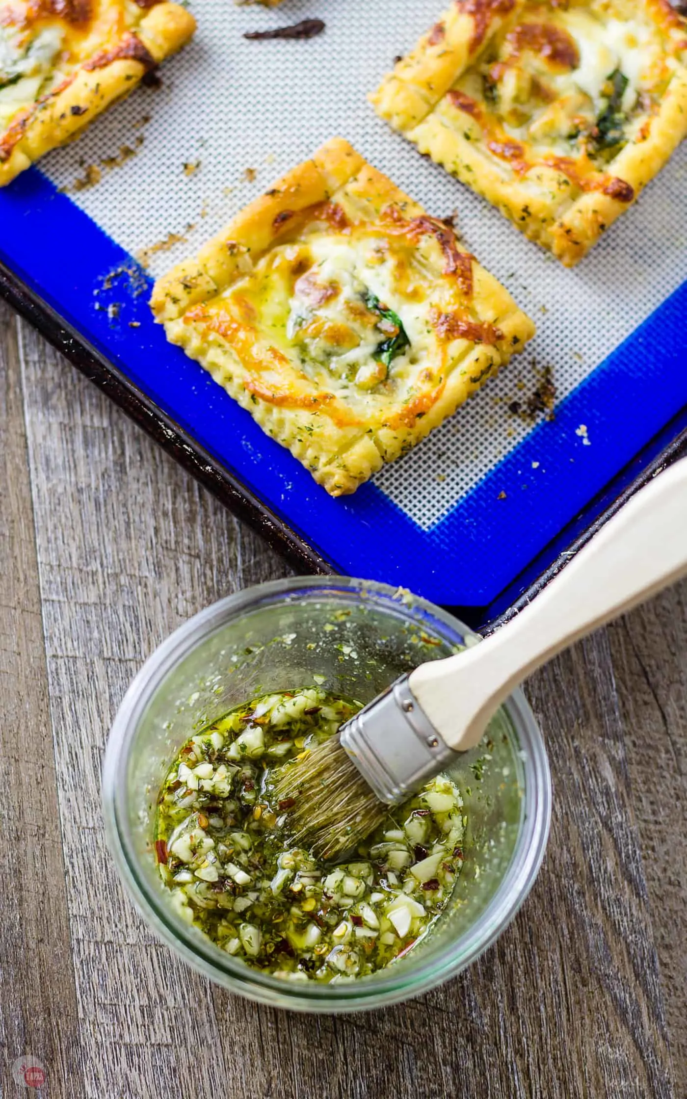 The garlic sauce for my White Pizza Mini Tarts will blow your mind! | Take Two Tapas #pizza #WhitePizza #Tarts