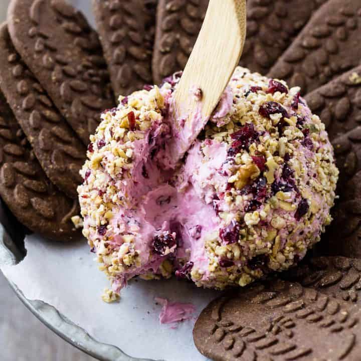 Blackberry Breakfast Cheese Ball with Granola and chocolate cookies on a platter