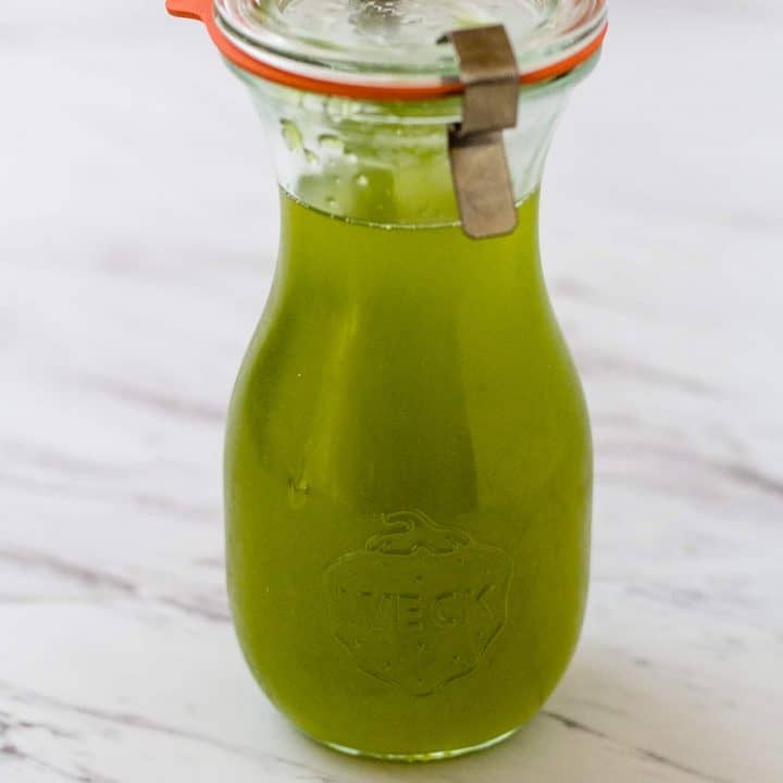 Chili Pepper Simple Syrup in a sealed carafe