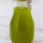 Close up of Chili Pepper Simple Syrup in a sealed carafe