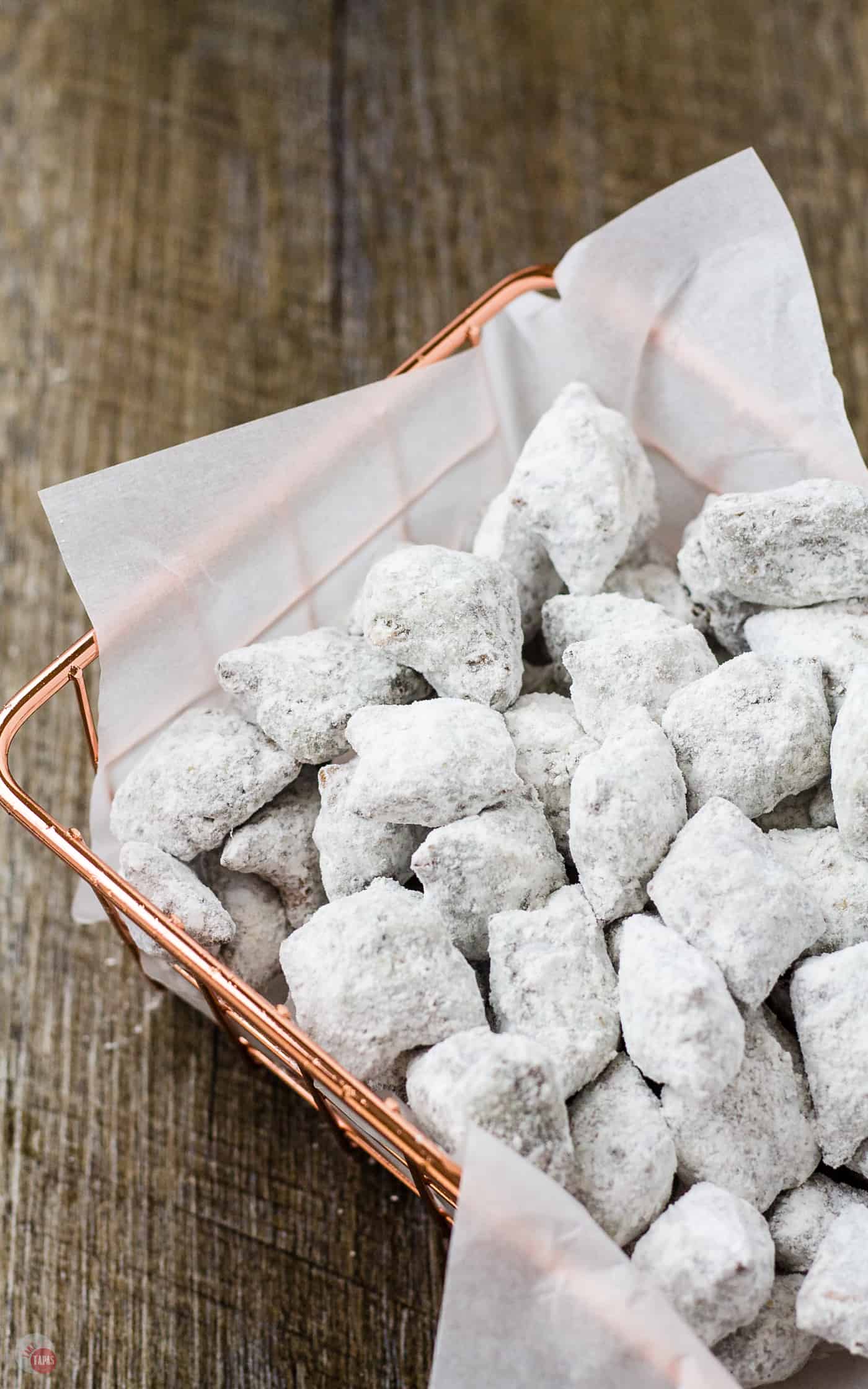 Nothing gets better than peanut butter and chocolate but I can think of two things that go great with the classic combo. Peanut Butter Pretzel Puppy Chow | Take Two Tapas | #PuppyChow #PeanutButterPretzel #SnackMix #PuppyChowRecipe #MuddyBuddyRecipe #PuppyChowVariation