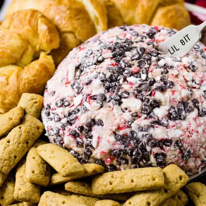 Peppermint Mocha cheese ball with cookies and croissants on a platter